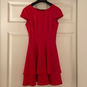 Red short sleeve dress with a bit of an open back and a bow